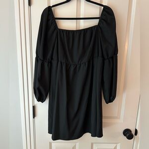 Black long sleeve bubble mini dress.